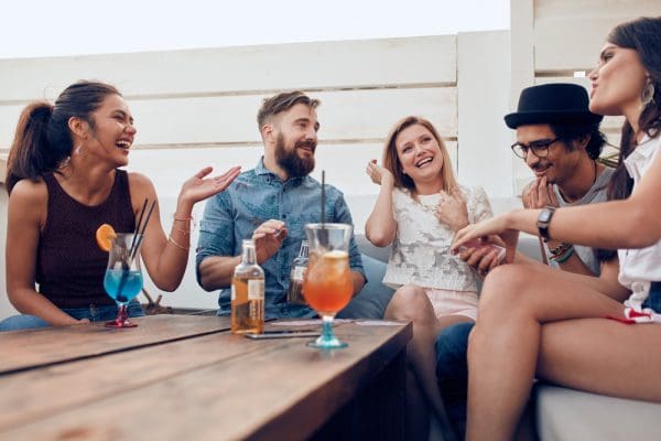 Portrait,Of,Happy,Young,People,Sitting,Together,And,Laughing.,Multiracial